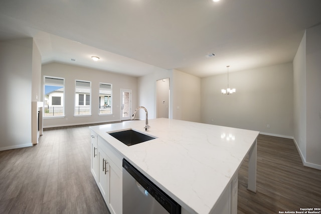 kitchen with a kitchen island with sink, sink, stainless steel dishwasher, and dark hardwood / wood-style floors