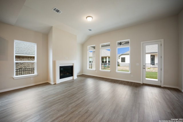 unfurnished living room with hardwood / wood-style floors