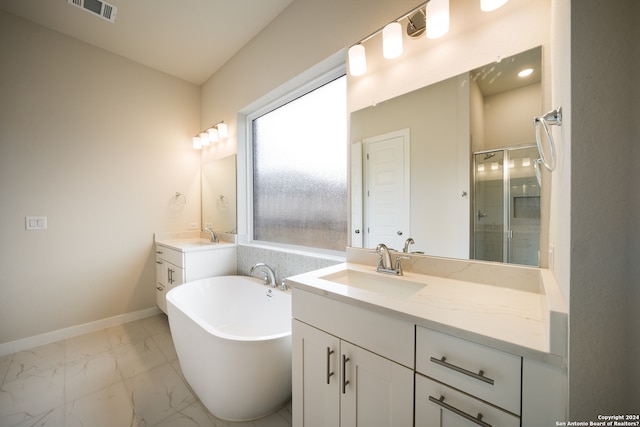 bathroom featuring vanity and shower with separate bathtub