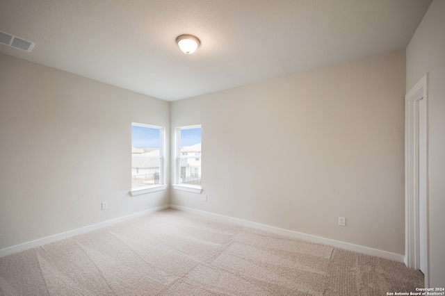 spare room featuring carpet flooring