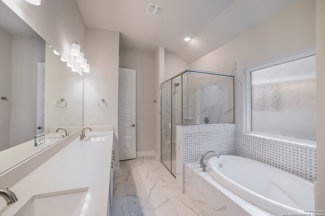 bathroom with lofted ceiling, independent shower and bath, double sink vanity, and tile flooring