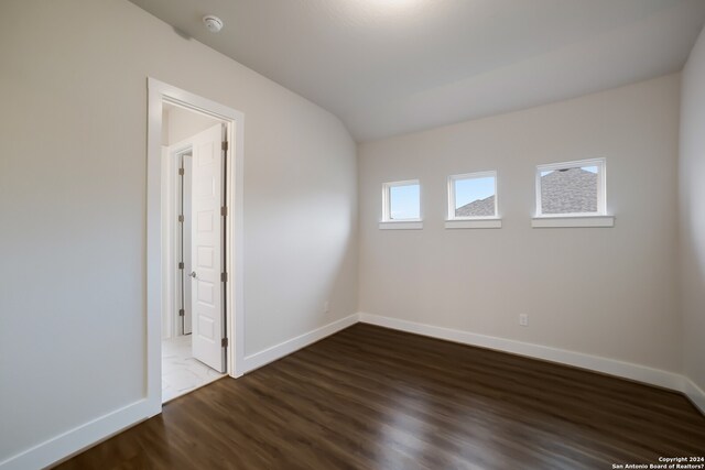 empty room featuring dark wood-type flooring