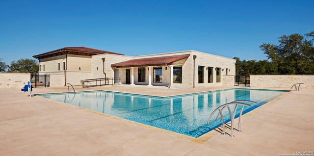 view of swimming pool featuring a patio area