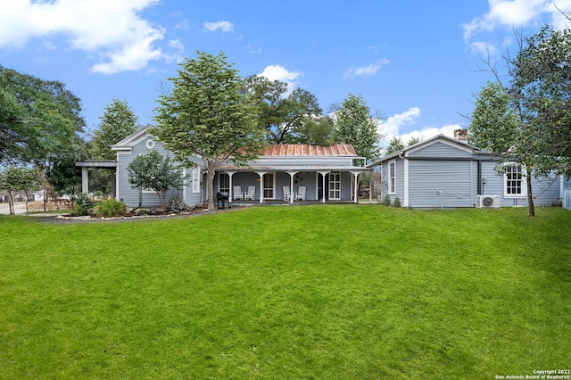 back of house featuring a lawn