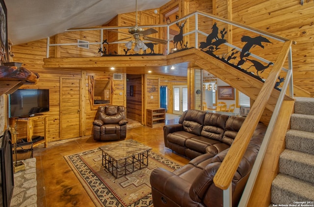 living room with ceiling fan and high vaulted ceiling