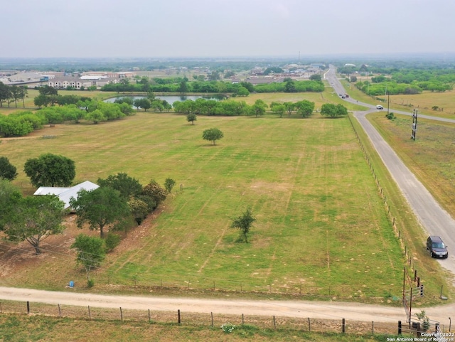 birds eye view of property with a rural view