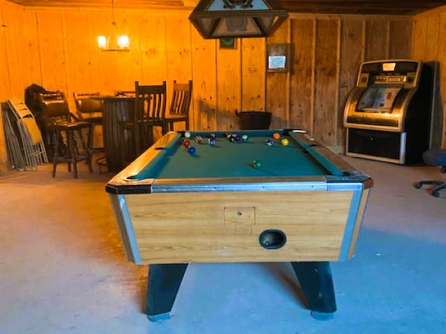 rec room with wooden walls and billiards