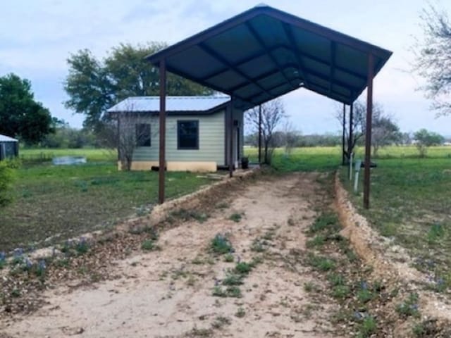 view of yard featuring a carport