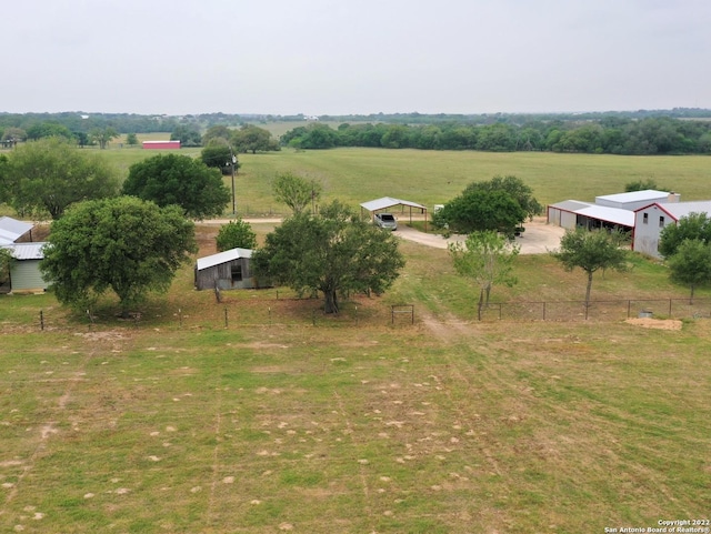 birds eye view of property with a rural view