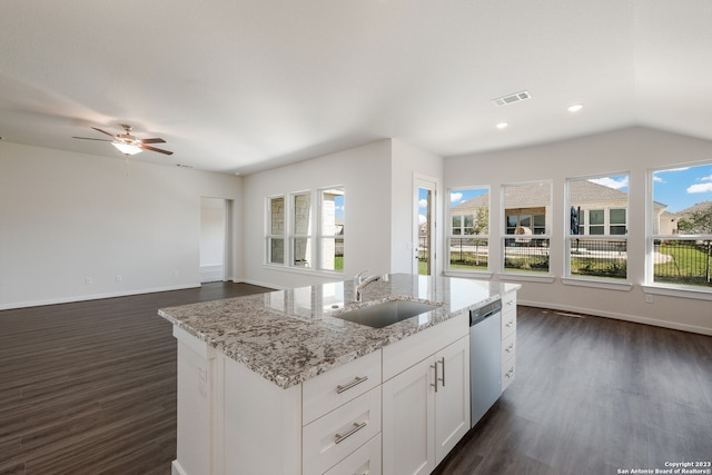 kitchen with light stone countertops, stainless steel dishwasher, sink, white cabinetry, and ceiling fan