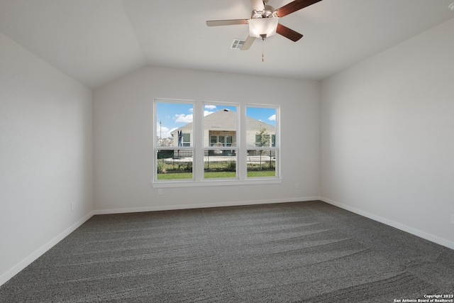 unfurnished room with lofted ceiling, ceiling fan, and dark colored carpet