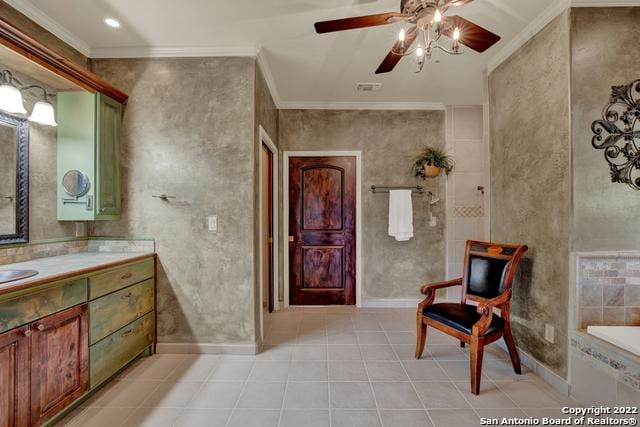 bathroom featuring tile floors, ornamental molding, and ceiling fan