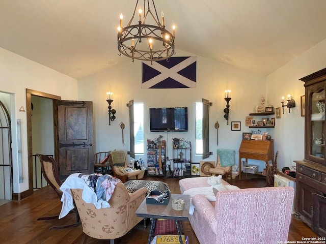 living room with an inviting chandelier, lofted ceiling, and dark wood-type flooring