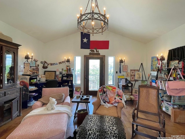 living room featuring a notable chandelier and vaulted ceiling