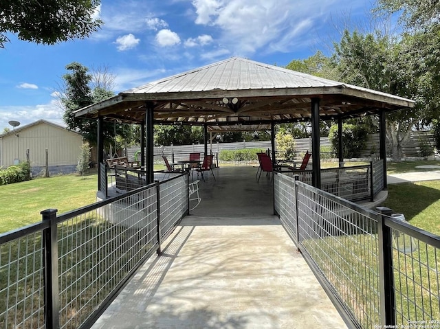 view of property's community with a gazebo and a lawn