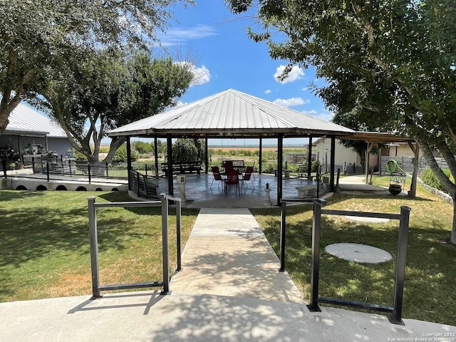 surrounding community featuring a lawn and a gazebo