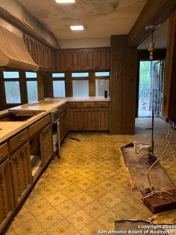 kitchen with decorative light fixtures and sink