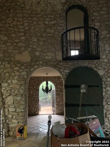 interior space with an inviting chandelier and tile flooring