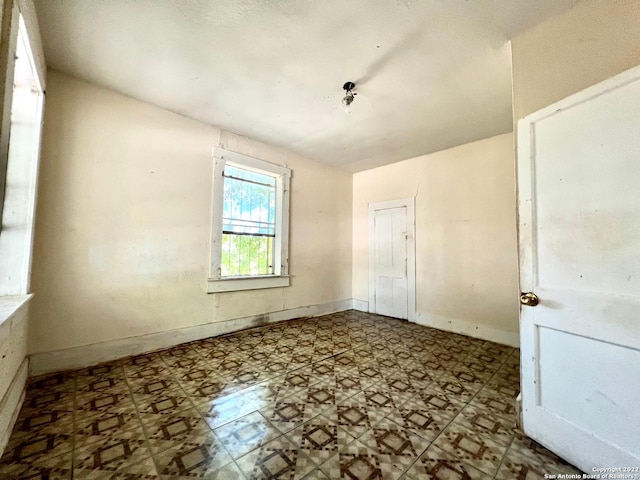 spare room featuring tile floors