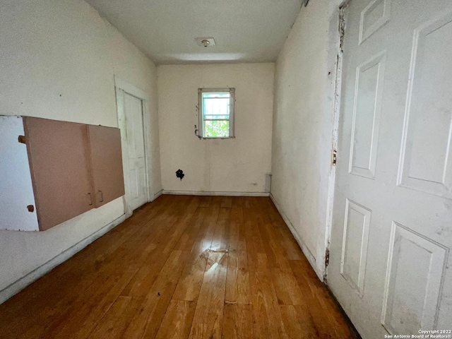 empty room with dark hardwood / wood-style floors