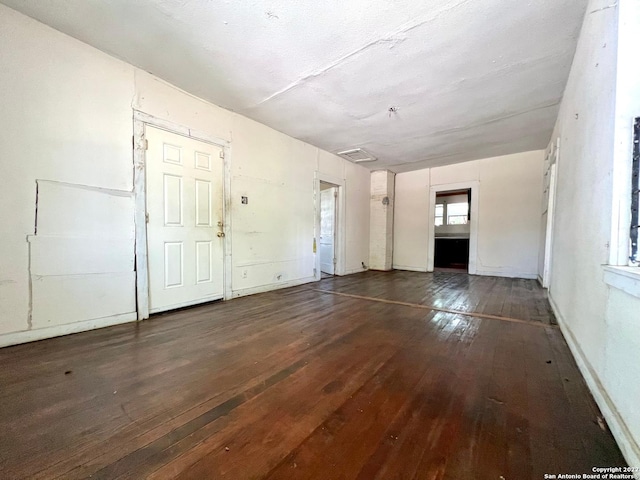 empty room featuring dark wood-type flooring