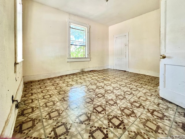 spare room with light tile floors