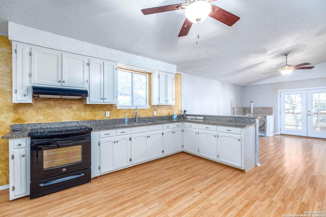 kitchen featuring white cabinets, light wood-type flooring, and black range with electric stovetop