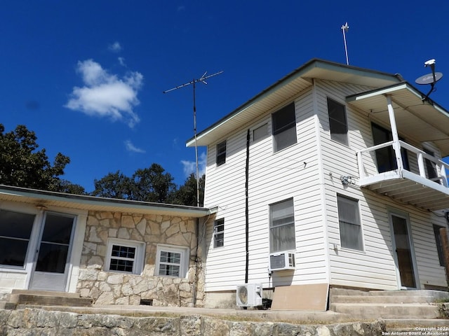 view of property exterior featuring a balcony