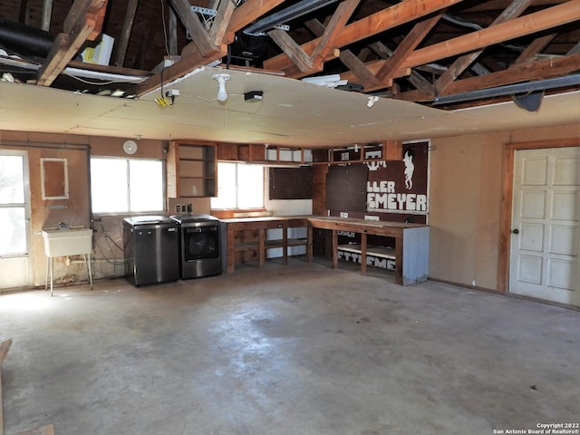 garage featuring washer and dryer and sink