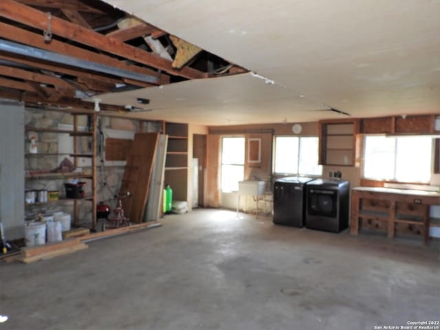 garage with washer and clothes dryer