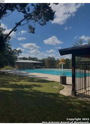 view of yard featuring a swimming pool