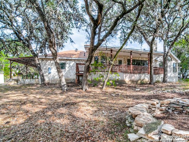 view of front of property with a wooden deck