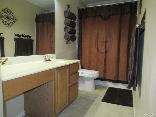 bathroom with toilet, oversized vanity, and crown molding