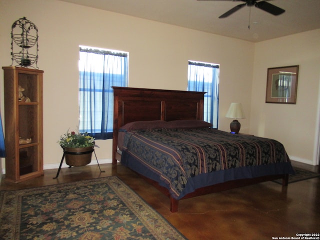 bedroom with multiple windows and ceiling fan