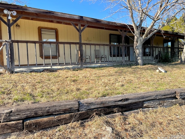 rear view of house with a lawn