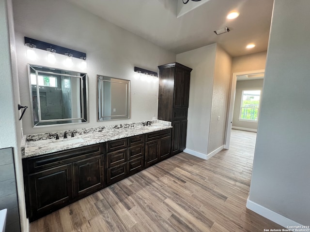 bathroom featuring vanity and wood-type flooring