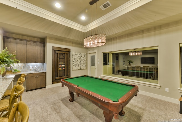 game room featuring light carpet, a raised ceiling, pool table, ornamental molding, and a high ceiling