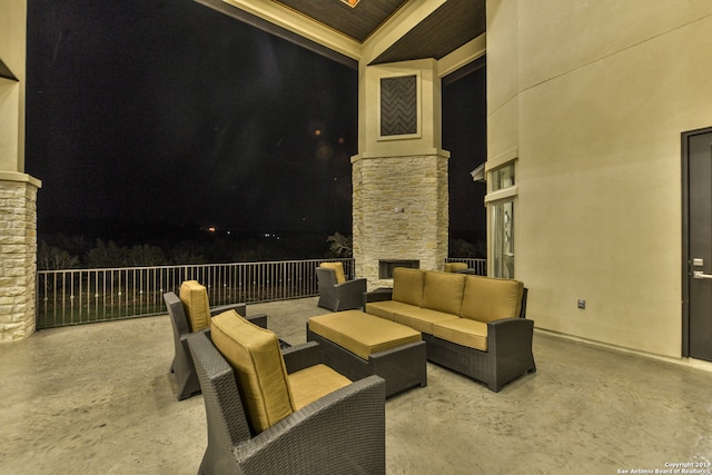 patio terrace at twilight featuring outdoor lounge area