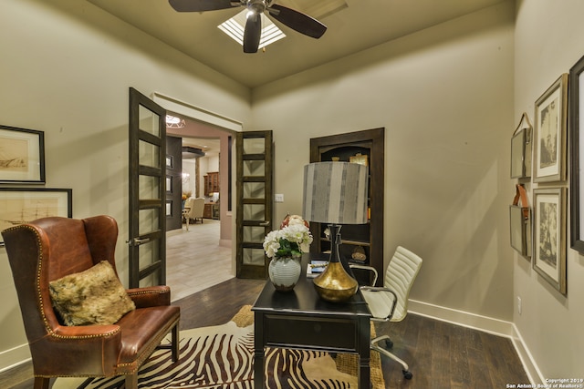 office space featuring french doors, dark wood-type flooring, and ceiling fan