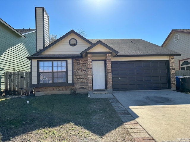 view of front facade featuring a front lawn and a garage