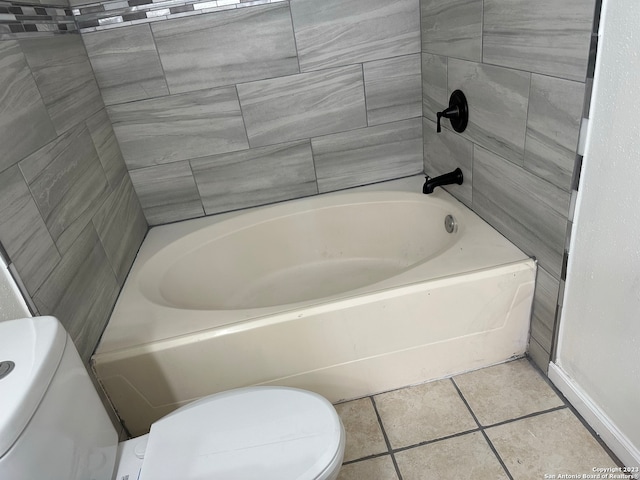 bathroom featuring toilet and tile floors