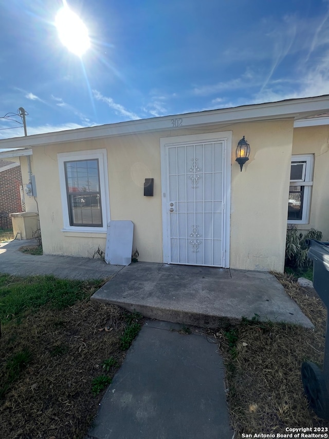 doorway to property featuring a patio