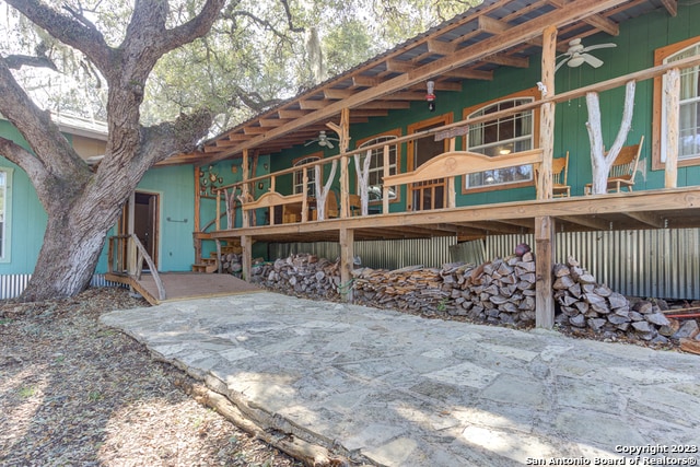 back of house featuring a deck