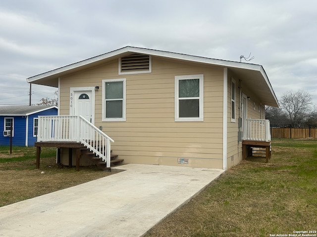 exterior space featuring a yard and a patio area