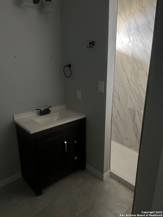 bathroom featuring vanity and tile floors