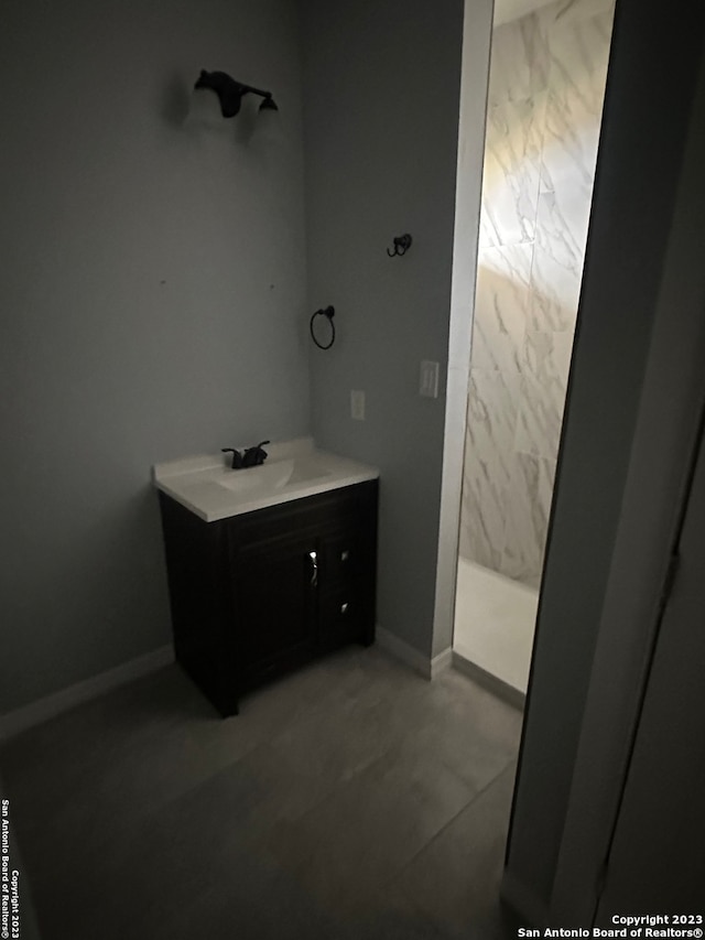 bathroom featuring vanity and tile flooring