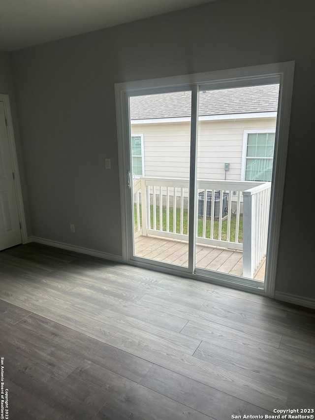 empty room with dark hardwood / wood-style floors