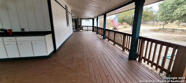 119 Cedar Tree Ln, Canyon Lake, TX 78133 - view of wooden terrace