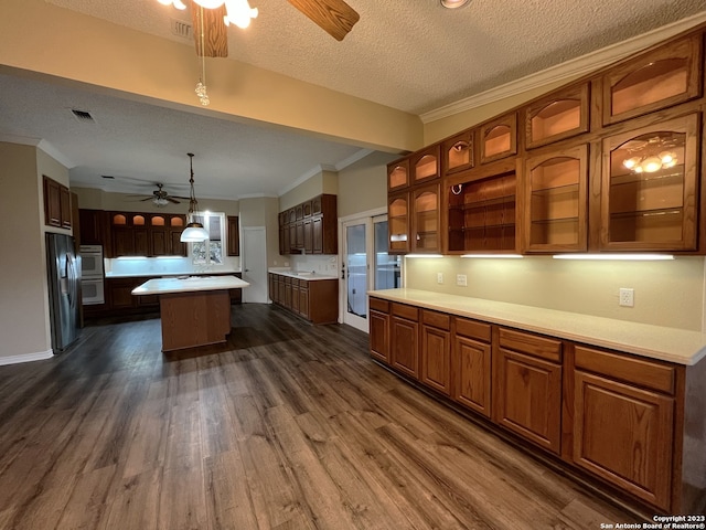 119 Cedar Tree Ln, Canyon Lake, TX 78133 - kitchen featuring hanging light fixtures, dark hardwood / wood-style flooring, ceiling fan, and a center island