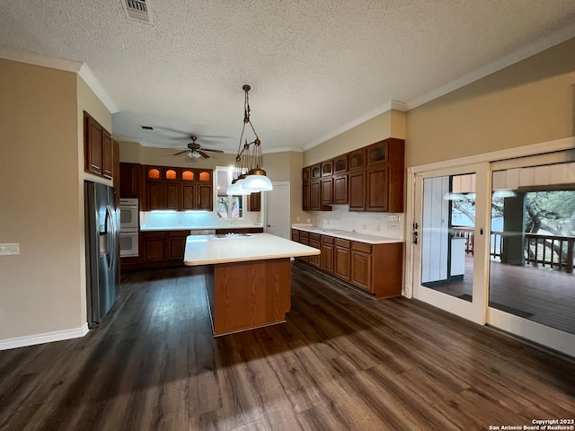 119 Cedar Tree Ln, Canyon Lake, TX 78133 - kitchen with dark hardwood / wood-style flooring, french doors, a kitchen island, stainless steel fridge, and ceiling fan